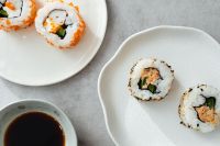 Kaboompics - Overhead Sushi Assortment with Maki Rolls and Soy Sauce