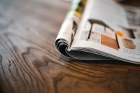 Kaboompics - Magazine on a wooden desk