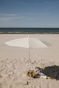 Kaboompics - White Beach Umbrella and Windbreak on the Shore
