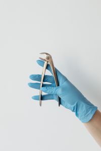 Kaboompics - Dental Extraction Instrument Against White Clinical Background