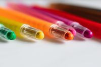 Kaboompics - Close-Up Rainbow Crayon Tips in Green, Yellow, Orange and Pink for Kids’ Art Content