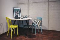 Kaboompics - Collection of chairs and tables arranged at a design exhibition