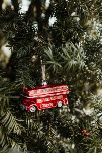 Kaboompics - Vertical Red London Bus Ornament on Evergreen Tree
