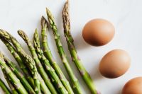 Kaboompics - Close-Up Asparagus and Brown Eggs on White, Minimal Healthy Food Styling