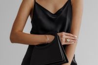 Kaboompics - Black Satin Camisole and Handbag with Ringed Hand