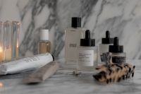 Kaboompics - Premium Skincare Bottles on Marble Pedestal