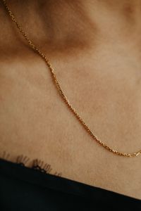 Kaboompics - Close-Up Gold Chain Necklace on Woman's Neck