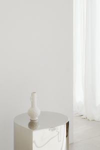 Kaboompics - Pantone 2026 Cloud Dancer: White Vase on a Round Table