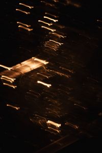 Kaboompics - Abstract Golden Light Reflections on a Dark Background