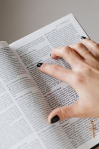 Kaboompics - Close-Up of a Hand Following a Passage in the Holy Bible