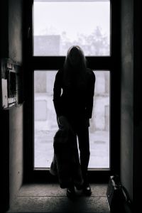 Kaboompics - Moody Backlit Fashion Silhouette in a Tall Industrial Window