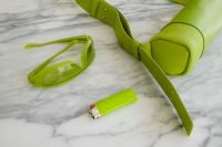 Kaboompics - Lime Green Accessories and Lighter on Marble