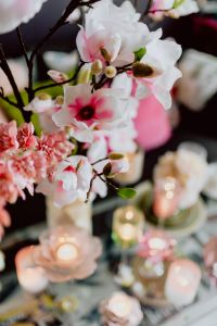 Kaboompics - Pink and White Magnolia Blossoms in a Vase with Soft Easter Table Bokeh