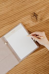 Kaboompics - Open Notebook and Hand With Writing Pen