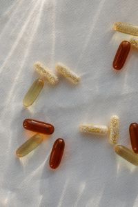 Kaboompics - Assorted Supplement Capsules on White Sheer Fabric