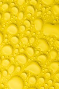 Kaboompics - Golden Yellow Water Drops in a Dense Macro Texture