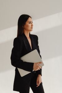 Kaboompics - Woman Carrying a Laptop in a Black Suit
