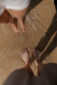 Kaboompics - Feet Standing in Wet Beach Sand