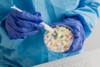 Kaboompics - Gloved Hands Sorting Tablets With Tweezers for Science Class