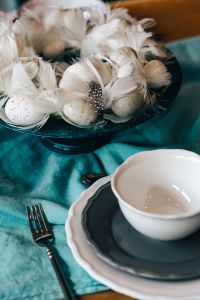 Kaboompics - Fancy restaurant dinner table decorated with quail eggs and feathers