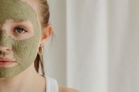 Kaboompics - Green Clay Face Mask Framing One Eye in a Close-Up Beauty Portrait