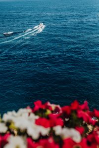 Kaboompics - Small Motorboat Leaving a Wake in Blue Amalfi Coast Water