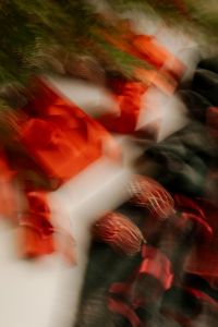 Kaboompics - Abstract Motion Blur of Red Christmas Gifts, Ornaments and Evergreen Branches