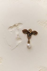 Kaboompics - Bee-Inspired Earring on Flour Backdrop