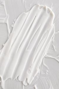 Kaboompics - Soft Cream Smear Texture Close-Up on Neutral Background