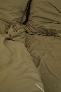 Kaboompics - Cozy Unmade Bed with Neutral Bedding