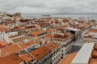 Kaboompics - Wide Old Town Rooftop View toward the Tagus River and a Passing Boat