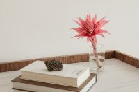Kaboompics - Stacked Books on a Marble Console Table