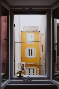 Kaboompics - Drink coffee in a golden cup at the window