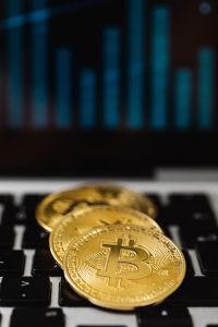 Kaboompics - Bitcoin Coins on Keyboard With Market Chart