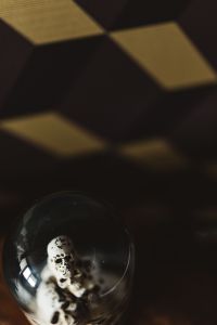 Kaboompics - Halloween Background with Skull Globe and Amber Geometric Shadows