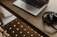 Kaboompics - Overhead Laptop and Camera on Wooden Home Office Desk