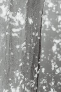 Kaboompics - Black and White Linen Curtain Texture with Soft Shadows