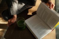 Kaboompics - Reading in Bed with a Green Smoothie and Natural Light