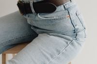 Kaboompics - Close-Up of Light Blue Wide-Leg Jeans and Black Belt, Casual Denim Fashion Detail