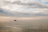 Kaboompics - Distant Boat on a Calm Sea Under Clouds