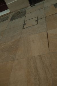 Kaboompics - Weathered Stone Sidewalk and Metal Utility Hatch, Old Town Texture