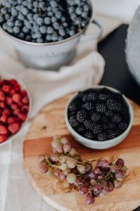 Kaboompics - Overhead Blackberry Bowl and Grapes on a Board