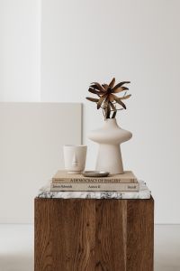 Kaboompics - Neutral Home Decor Still Life with Sculptural Vase, Face Cup and Art Books