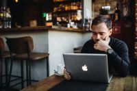 Kaboompics - Young Entrepreneur Working from a Modern Cafe