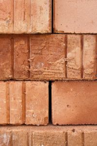 Kaboompics - Stacked Terracotta Bricks in a Rustic Wall Pattern