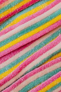 Kaboompics - Diagonal Rainbow Sour Candy Belts in Pink, Green and Yellow