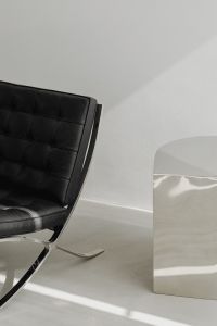 Kaboompics - Close-Up Black Leather Chair and Reflective Chrome Table