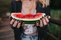 Kaboompics - Blonde woman having a healthy snack at the wooden pier