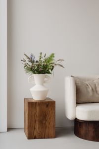 Kaboompics - White Vase with Wildflowers beside Armchair and Neutral Wall