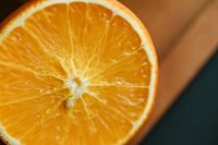 Kaboompics - Close-Up Orange Half Showing Juicy Citrus Texture, Fresh Summer Recipe Background